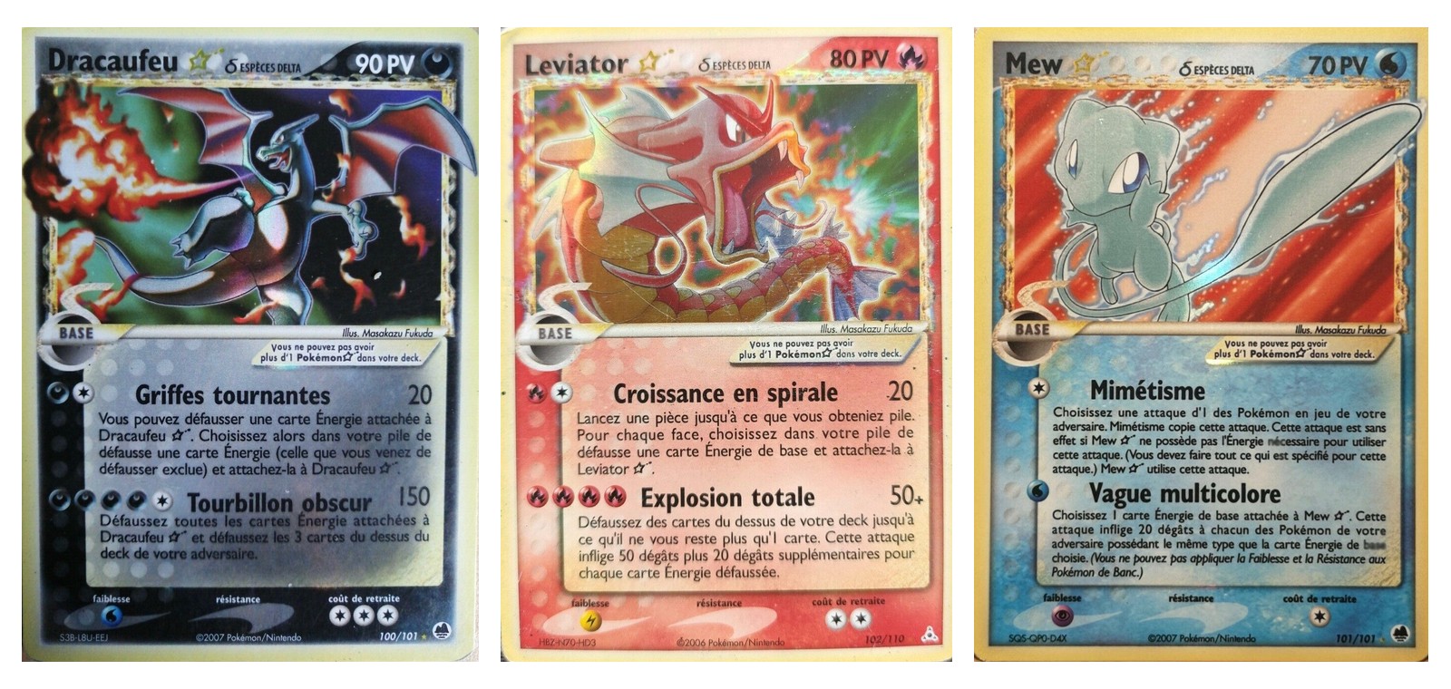 Les cartes Dracaufeu étoile δ de type Obscurité, Léviator étoile δ de type Feu et Mew étoile δ de type Eau