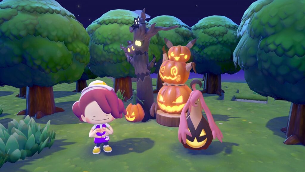 Banshitrouye dans son habitat orné de citrouilles et d'un arbre hanté dans Pokémon Pokopia