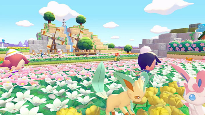 Champ de fleurs de Pokopia avec Phyllali et Nymphali au premier plan et des moulins en arrière-plan